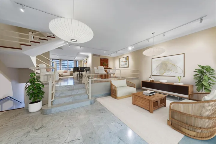 Living and Dining Area - This image has been virtually staged and does not reflect the current state of the property.
