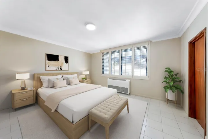 Primary Bedroom - This image has been virtually staged and does not reflect the current state of the property.