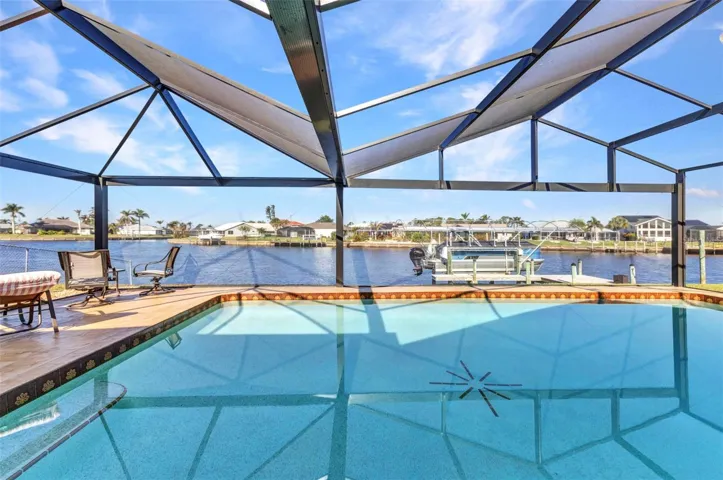 What an AMAZING VIEW!! Float around and watch the sunsets in the pool with picture window views of the wide intersecting canal.