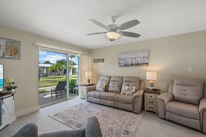 Living room features all brand new furniture and new window treatments. Out back you will find tropical landscapes. You are located in the middle of 2 resort style sparkling pools.