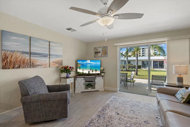 Living room features all brand new furniture and new window treatments. Out back you will find tropical landscapes. You are located in the middle of 2 resort style sparkling pools.