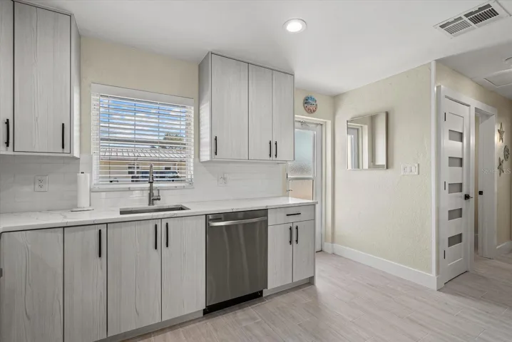 Beautifully renovated kitchen. European imported cabinets, quartz counters and new appliances.