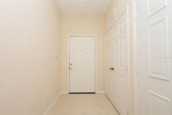 Foyer with tile flooring.