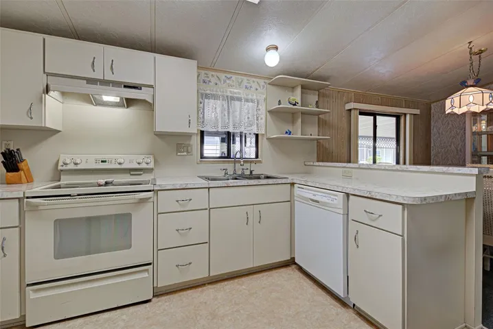KITCHEN IS BRIGHT & CLEAN.