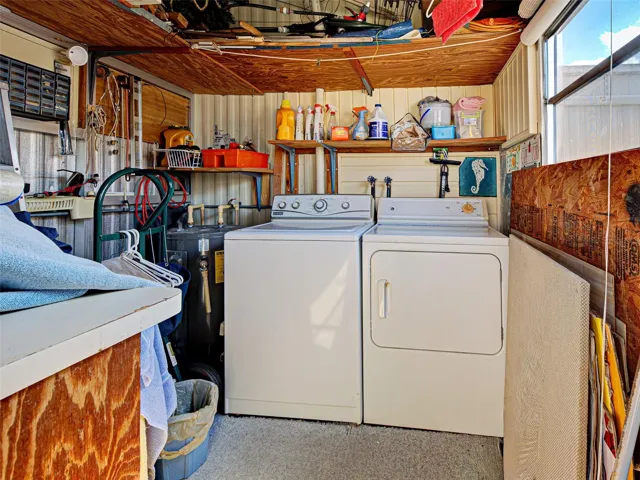 ATTACHED LAUNDRY / STORAGE SHED. UNDER ROOFLINE.