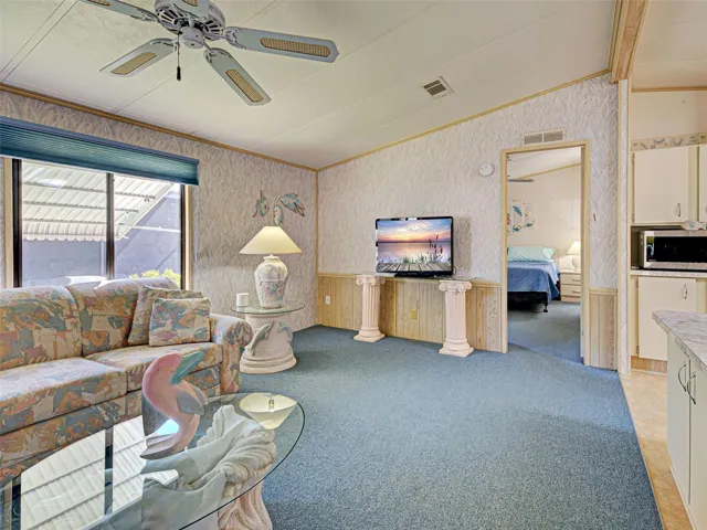 LIVING ROOM WITH VAULTED CEILINGS.