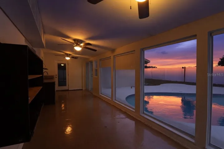 Covered lanai/patio with pool view