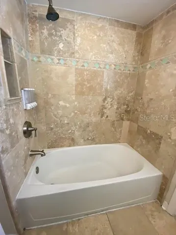 Hallway bathroom with bathtub