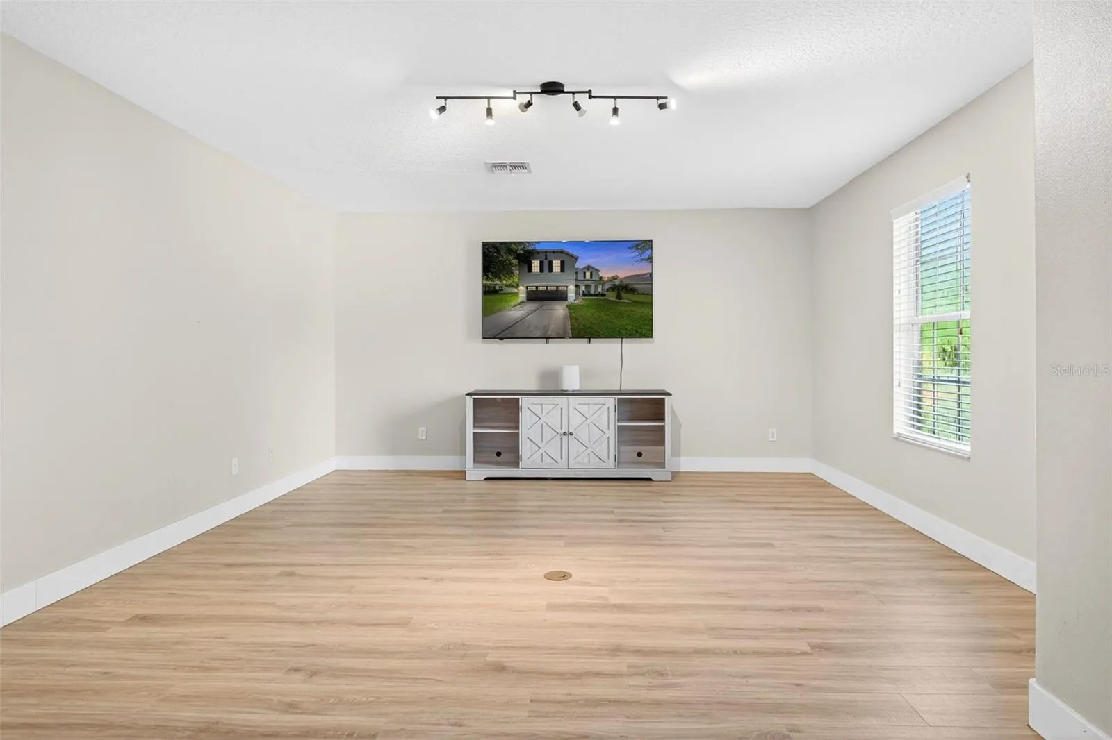 Oversize wall with no windows is perfect for that theater size TV
