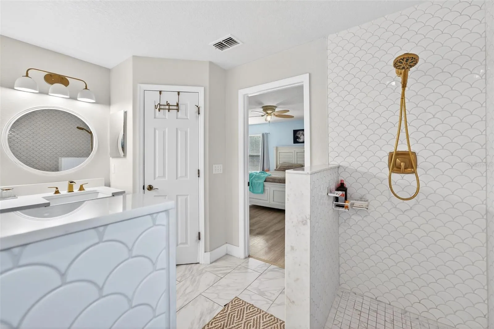 Private water closet and another view of the beautiful shower wall tile