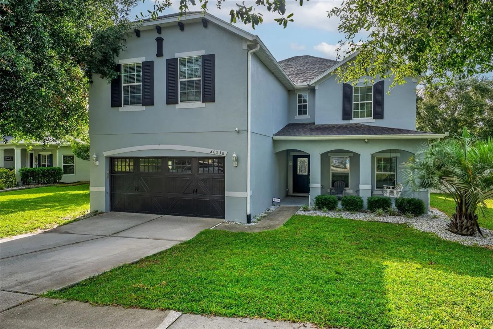 Shutters, garage door windows and beautiful trim makes this house standout