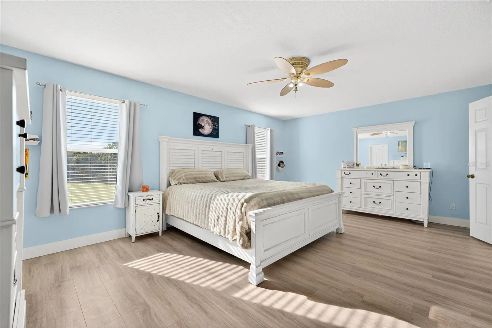 Breathtaking and soothing upstairs primary suite with amazing views of the conservation area