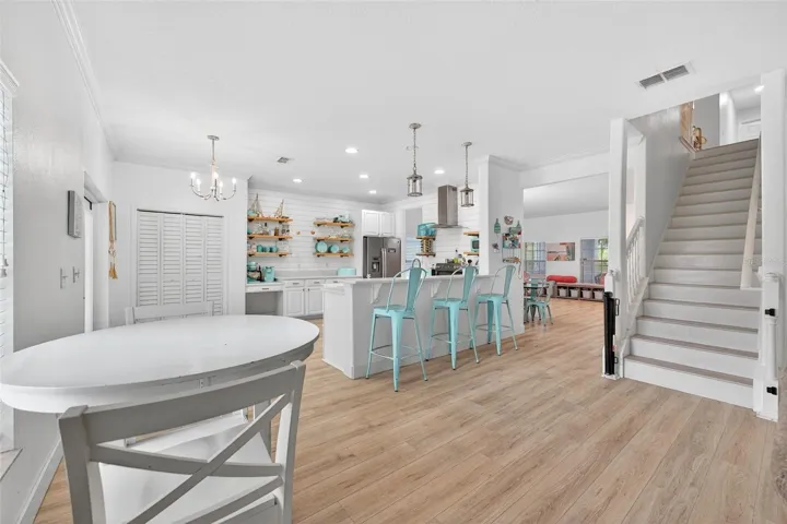 Dinette area and no carpet stairs leading to the huge 2nd floor