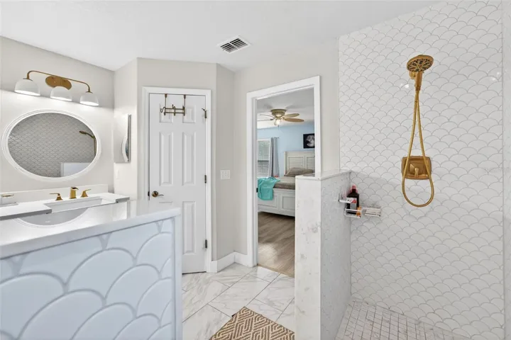 Private water closet and another view of the beautiful shower wall tile