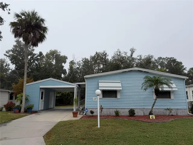 Front with large carport