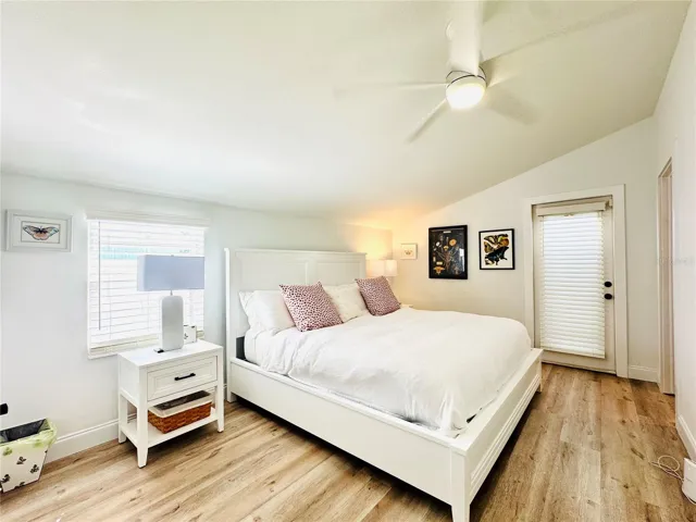 Second bedroom with a door leading straight to backyard, jacuzzi & pool.