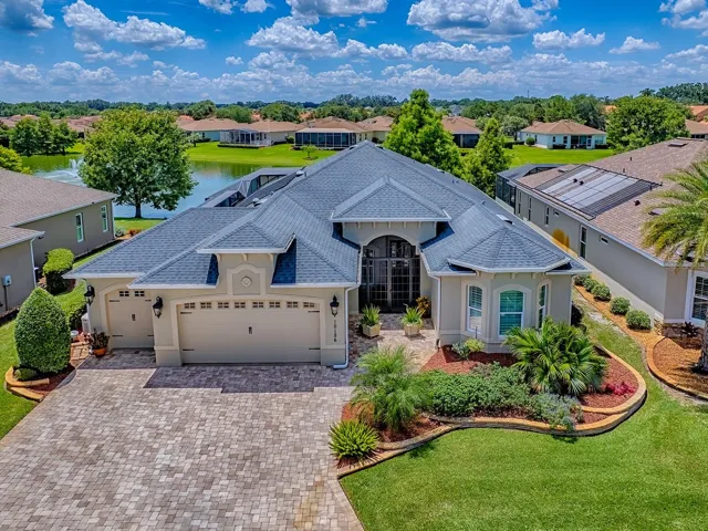 LOVELY "LAKESIDE" MODEL HOME ON POND WITH FOUNTAINS - 3 BEDROOM, 2 BATH + DEN  -OVER 2300 SF + FLORIDA ROOM ADDING ANOTHER 300+ SF, AND INFINITY EDGE POOL!