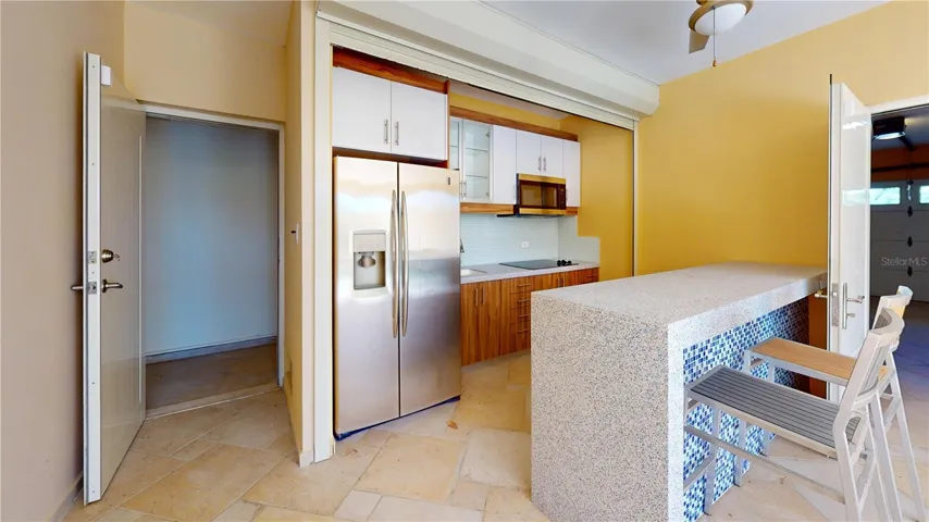 Outdoor kitchen is protected with a rollup shutter