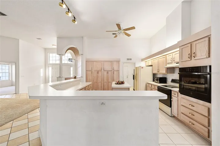 Kitchen to the right of living room