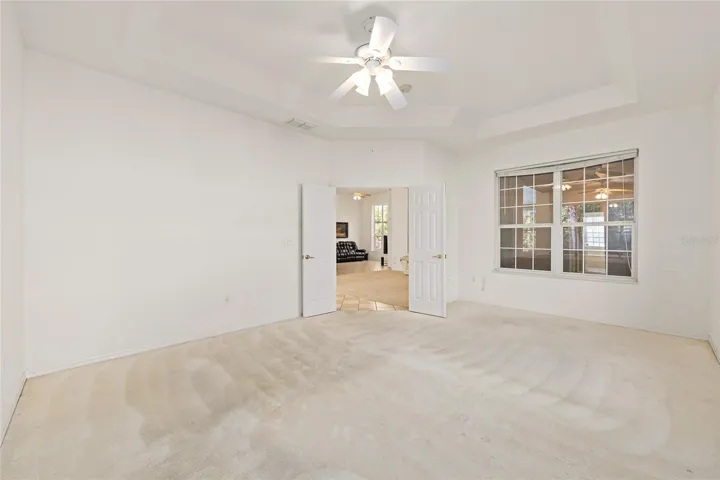 Master bedroom with French doors and windows to Lanai