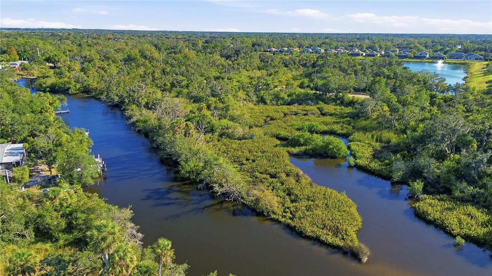 New Drone Photo#4 (12-03-2025) showing "The Lagoon" and the northeastern tip of the property.  This shot is looking bach southerly toward Upper Manatee Rivfer Road