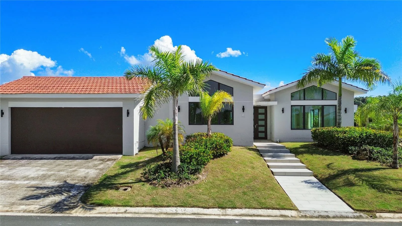 This home features the newest Casona del Lago floor plan in a corner-lot configuration