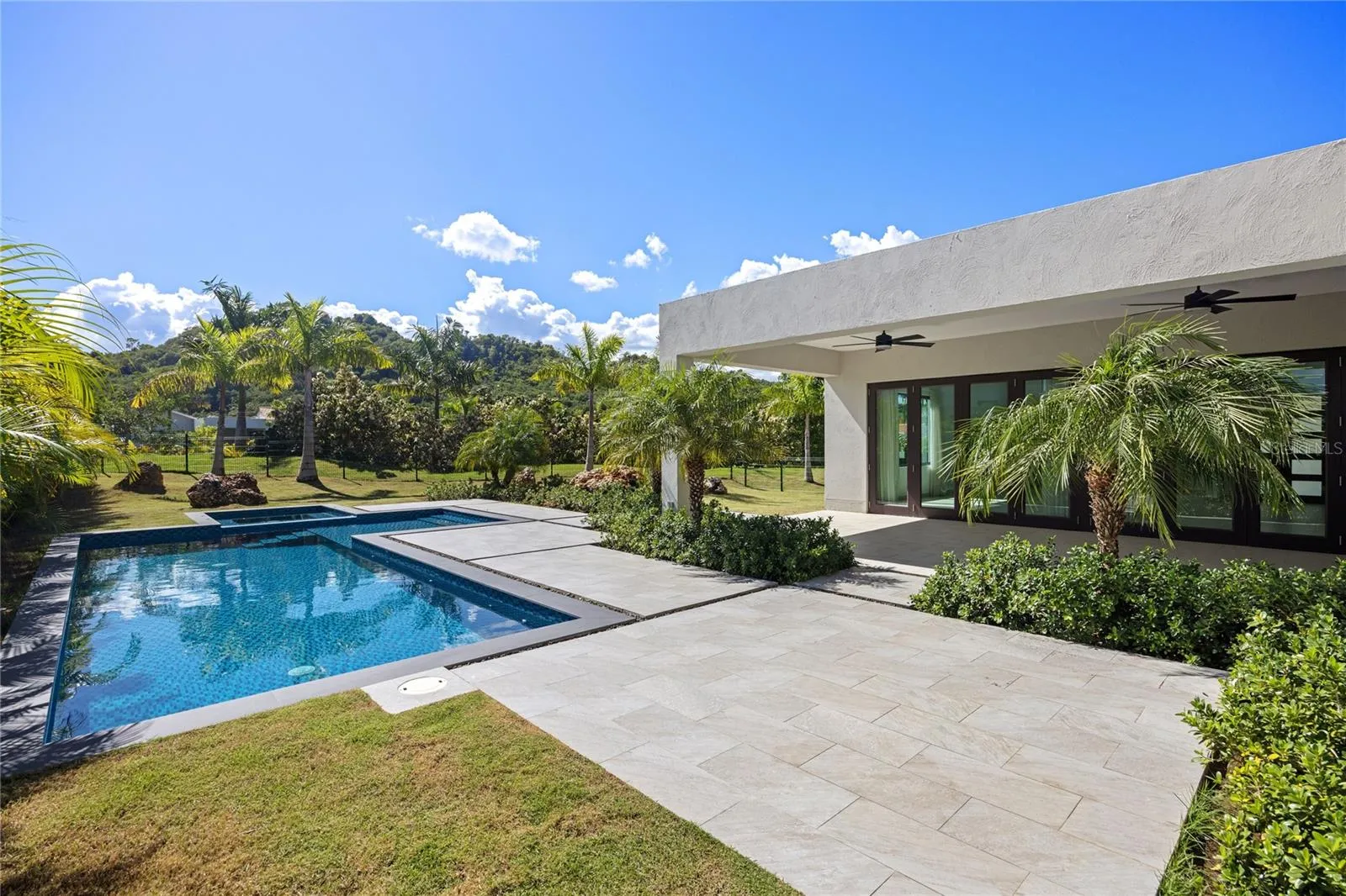 fully move-in ready with custom finishes, a pool, jacuzzi, and upgraded systems throughout.