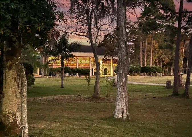 View of Pine Lakes club house at sunset from lanai