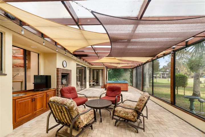 Lanai with spa, sink and built in pizza oven
