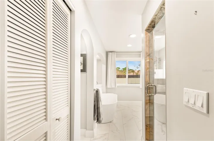 Primary bath view of shower and tub