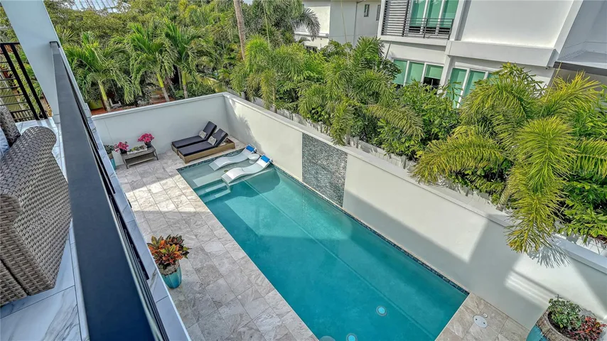 View of pool from the back balcony.