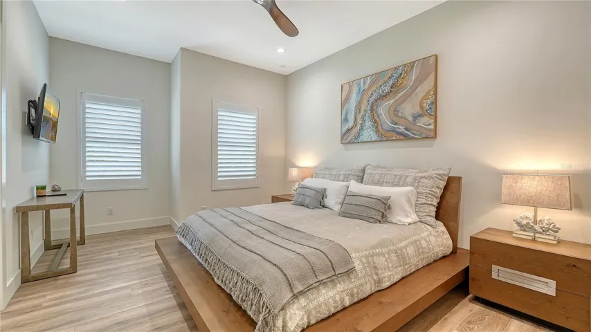 Bedroom two features ceiling fan, walk-in closet, plantation shutters and Jack and Jill bathroom.