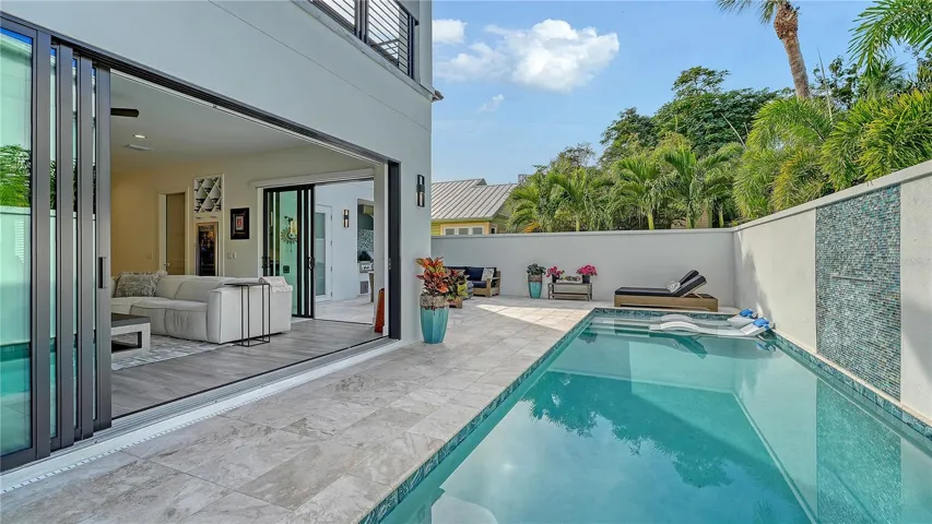 Pool deck opened up to indoor space