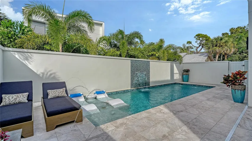 Heated saltwater pool and marble pool deck.