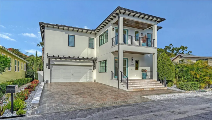 Front View of House and 2 Car Garage.