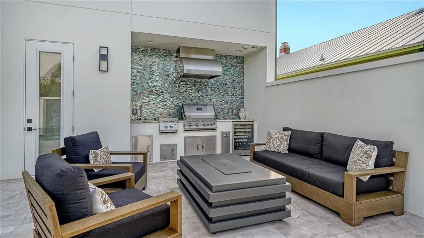 Outdoor Kitchen, with the convenience of  half bath and outdoor shower.