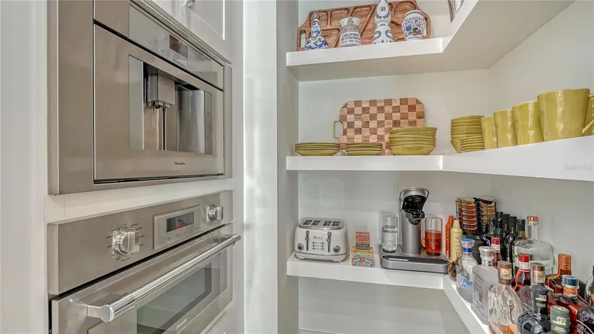 Walk-in pantry with bulit in coffee/tea beverage center and quick oven/microwave.