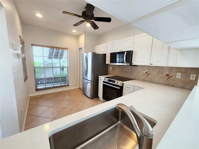 Modern Single Basin sink, new faucet, and new disposal.