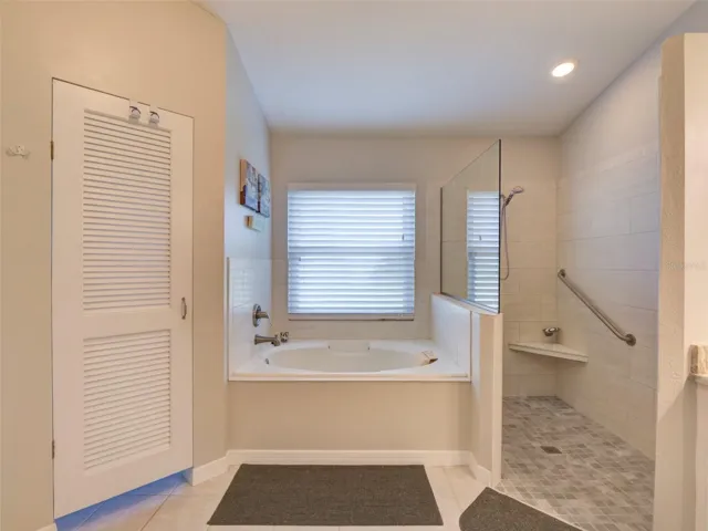 Primary: Private Toilet, Soaker Tub & Handicapped Accessible Shower
