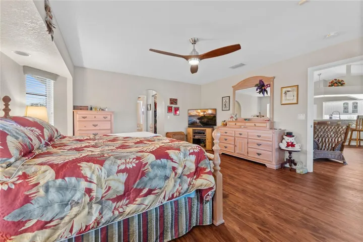 Primary Bedroom With With Water View, Lanai Access & En-Suite Bath