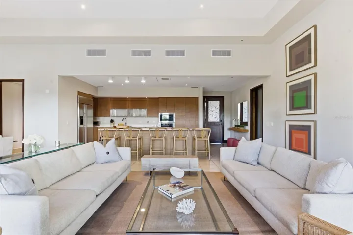 Seamless open-concept living where the kitchen flows effortlessly into the dining and lounge areas, perfect for modern resort living.