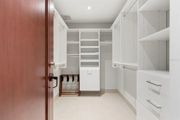 Expansive walk-in closet with custom shelving.