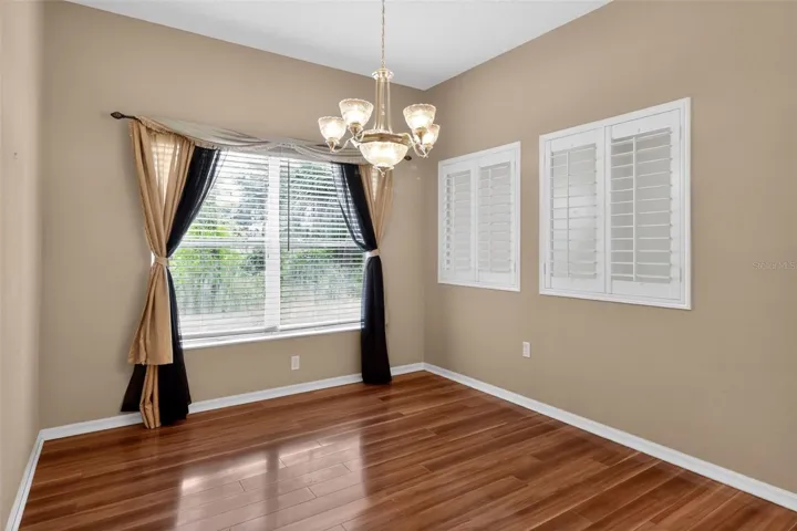 Formal dining room with laminate flooring