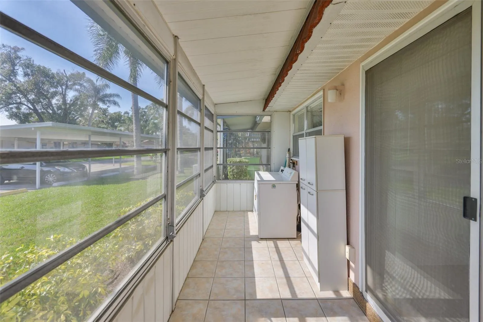 Florida Room with washer and dryer, rear door