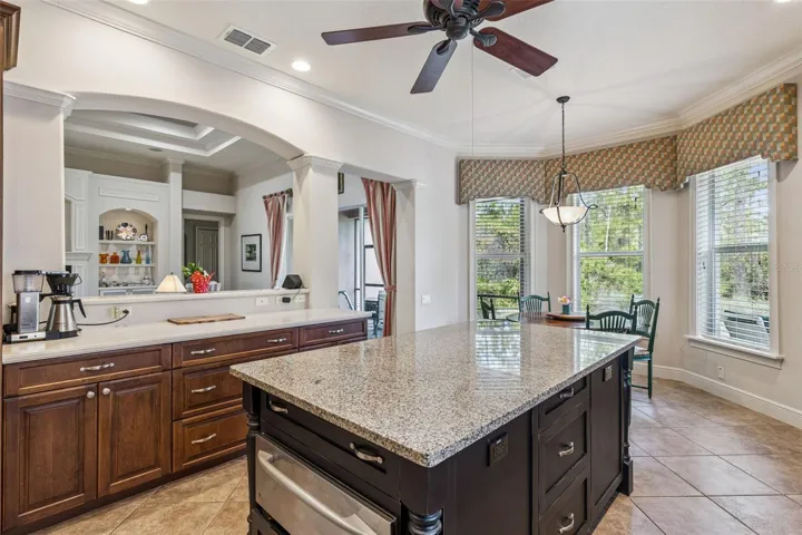 View of the kitchen island w/ sliding drawers & Dinette area