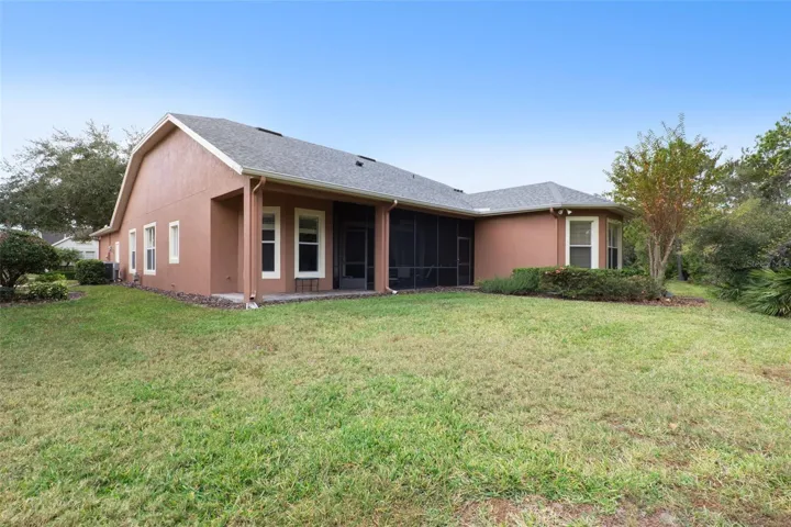 View of the rear of the home & backyard