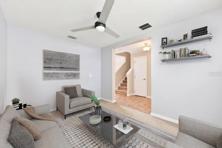 A separate formal living room welcomes you into the home. Virtually Staged