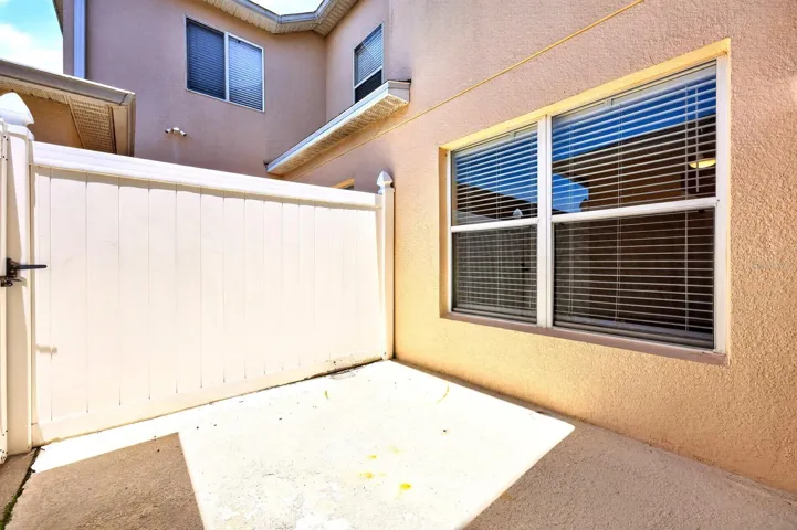 Sliding glass doors lead to the patio, creating an effortless INDOOR-OUTDOOR CONNECTION.