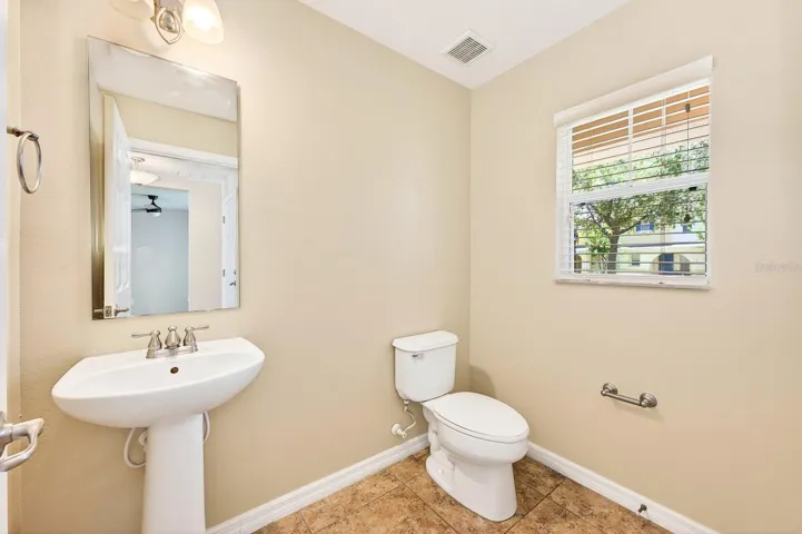 A convenient half bath completes the first floor.