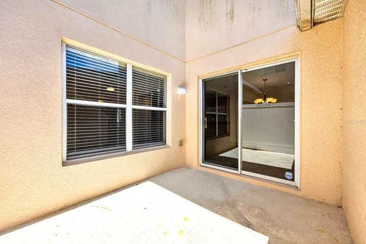 Sliding glass doors lead to the patio, creating an effortless INDOOR-OUTDOOR CONNECTION.